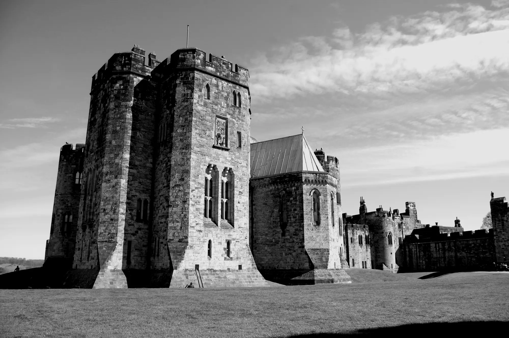 Alnwick Castle seen across its lawn.